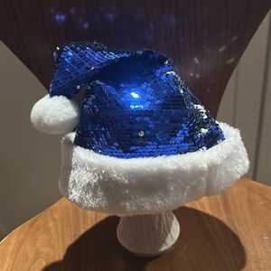 Child’s blue sequin Santa hat nwot